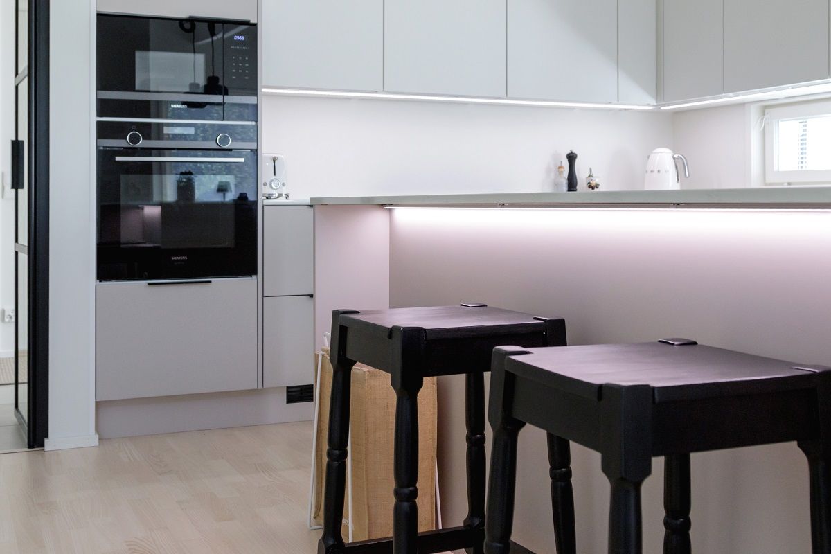 The LED strip light under the table top in the kitchen island is a beautiful effect light, and a mood creator © LedStore.fi